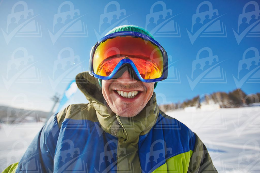 Skiing person up close with goggles on